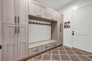 Mudroom with light wood-type flooring