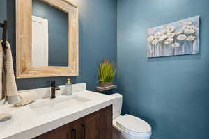 Bathroom featuring toilet and vanity