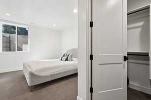 Carpeted bedroom featuring baseboards and recessed lighting