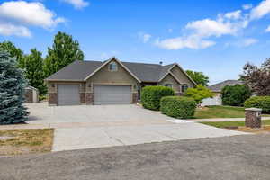 View of front of property featuring a garage with RV, Trailer or Boat Parking