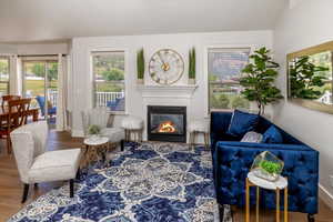 Living room with hardwood flooring & fireplace