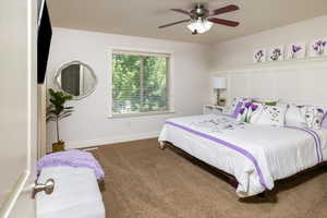 Master Bedroom with carpet flooring and ceiling fan