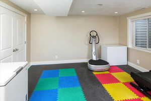 Workout room with a textured ceiling