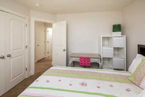 Bedroom with a closet and carpet floors