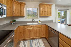 Kitchen with stainless steel appliances and sink