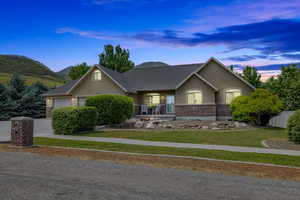 View of front of home featuring a garage and a mountain view