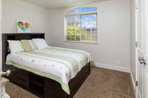 Bedroom featuring carpet flooring