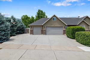 View of front of property featuring a garage & RV, Trailer or Boat parking