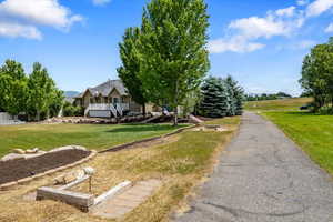 View of yard with horseshoe game & walking / biking trail