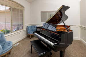 Front Entry room featuring plenty of natural light and carpet flooring