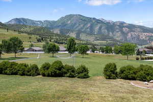 Mountain view featuring a rural view of community playground & picnic area