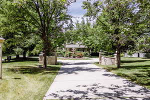 View of home's community with a yard