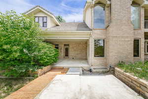 2nd covered patio with french doors into the family/media room and the main floor office.