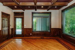 Office with full closet, shelving and door to covered patio.  Beautiful wood trimmed ceilings.