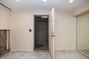 View of entrance to stairs to garage.