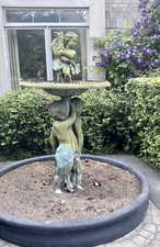 Garden with statue off front entrance, in-front of dining room window.