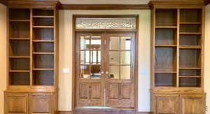 Step down, into the family/media room. Entrance into kitchen, hallway to foyer and office with a main floor bedroom or step out onto the covered patio where the Sauna is.