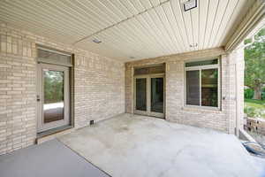 2nd covered patio with french doors into the family/media room and the main floor office.