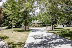 View of home's community featuring a yard