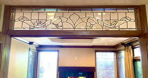 Magnificent leaded glass from Foyer hallway into grand family room.