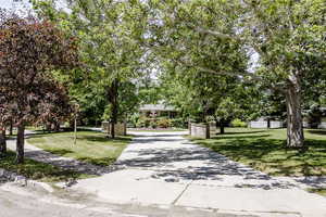 View of property's community with a yard