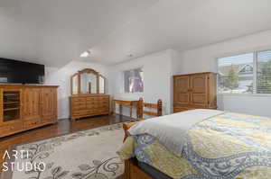 Bedroom with wood-type flooring