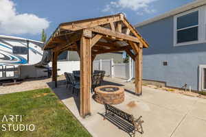 View of patio / terrace featuring an outdoor fire pit