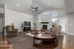 Living room with high vaulted ceiling and ceiling fan