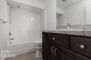 Full bathroom  shower / washtub combination, oversized vanity, and toilet