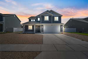 View of front of home featuring a garage