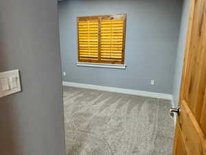 Empty room with carpet floors