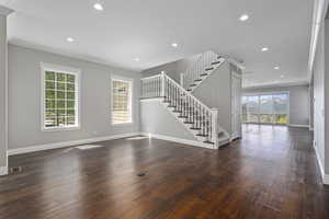 Living/music room looking into family room. Stairs to 2nd level