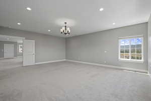 Largest primary bedroom, 2nd floor, looking into upstairs family room/den/game room with elevator in the distance