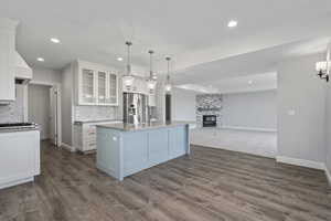 Lower level downstairs kitchen includes looking at family room/den