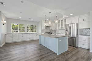 Lower level full kitchen including breakfast bar, eating area, walk-in pantry