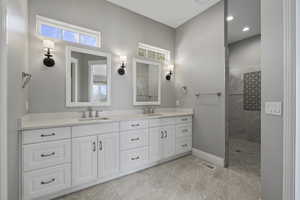 Main floor primary bathroom, double sinks, large walk-in shower and closet,