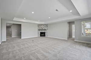 Lower level family room/den, fireplace, hallway to 3 additional bedrooms and bathroom