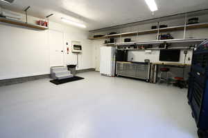 Garage with white fridge