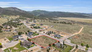 Birds eye view of property with a mountain view