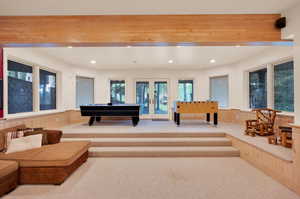 Game room featuring beam ceiling, billiards, french doors, and carpet floors