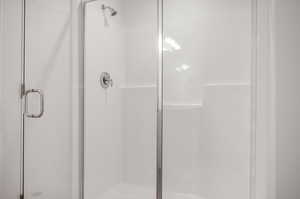 Bathroom with a shower with shower door