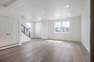 Unfurnished living room with light hardwood / wood-style floors