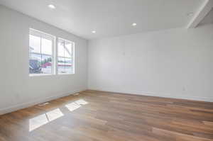 Unfurnished room with light hardwood / wood-style floors