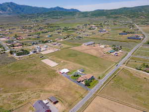 Drone / aerial view featuring a rural view and a mountain view