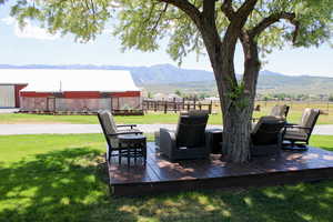 View of patio with a deck with mountain view