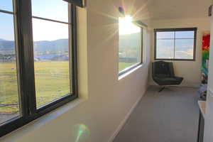 Sunroom with a mountain view