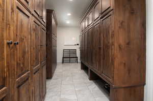 Mudroom with light tile floors