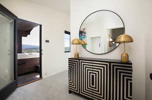 Corridor with carpet and a mountain view