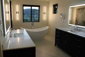 Bathroom featuring vanity, a mountain view, and tile floors