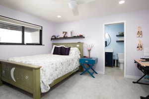 Bedroom featuring carpet, ceiling fan, and ensuite bath